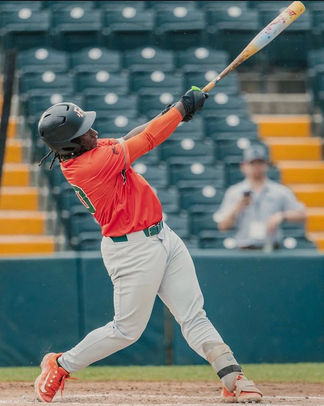 Florida A&M Rattlers' Jay Campbell slams a hit during an NCAA college baseball game, part of the 2026 Andre Dawson Classic at the Jackie Robinson Training Complex in Vero Beach, Florida.