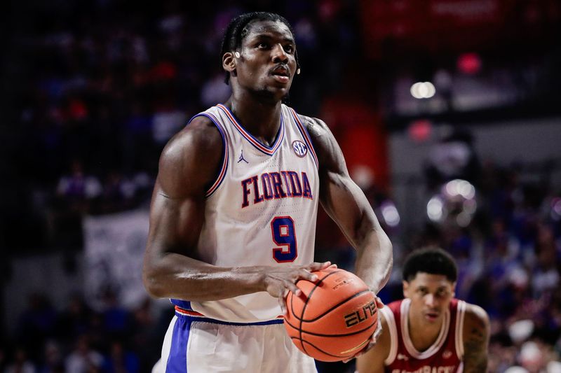 Feb 28, 2026; Gainesville, Florida, USA; Florida Gators center Rueben Chinyelu (9) attempts a free throw against the Arkansas Razorbacks during the second half at Exactech Arena at the Stephen C. O'Connell Center. Mandatory Credit: Travis Register-Imagn Images