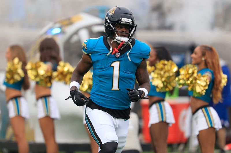 Jacksonville Jaguars running back Travis Etienne Jr. (1) is introduced before an NFL football game at EverBank Stadium, Sunday, Dec. 7, 2025, in Jacksonville, Fla.