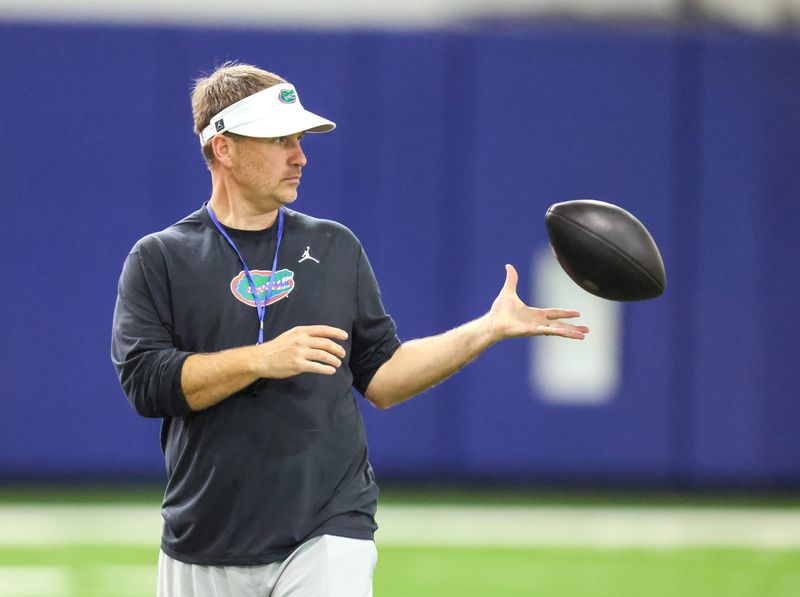 Florida offensive coordinator Buster Faulkner works out the quarterbacks during the first day of Florida Spring football practice at Heavener Football Center in Gainesville, FL on Tuesday, March 3, 2026. [Alan Youngblood/Gainesville Sun]