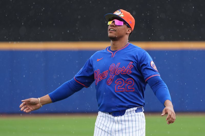 Feb 28, 2026; Port St. Lucie, Florida, USA; New York Mets right fielder Juan Soto (22) stretches in a light rain before the game against the Washington Nationals at Clover Park. Mandatory Credit: Jim Rassol-Imagn Images