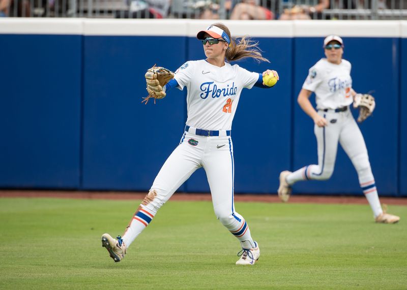 May 29, 2025; Oklahoma City, OK, USA; Florida Gators outfielder Taylor Shumaker (21) throws the ball in after fielding it in the sixth inning against the Texas Longhorns during the NCAA Softball Women's College World Series at Devon Park. Mandatory Credit: Brett Rojo-Imagn Images