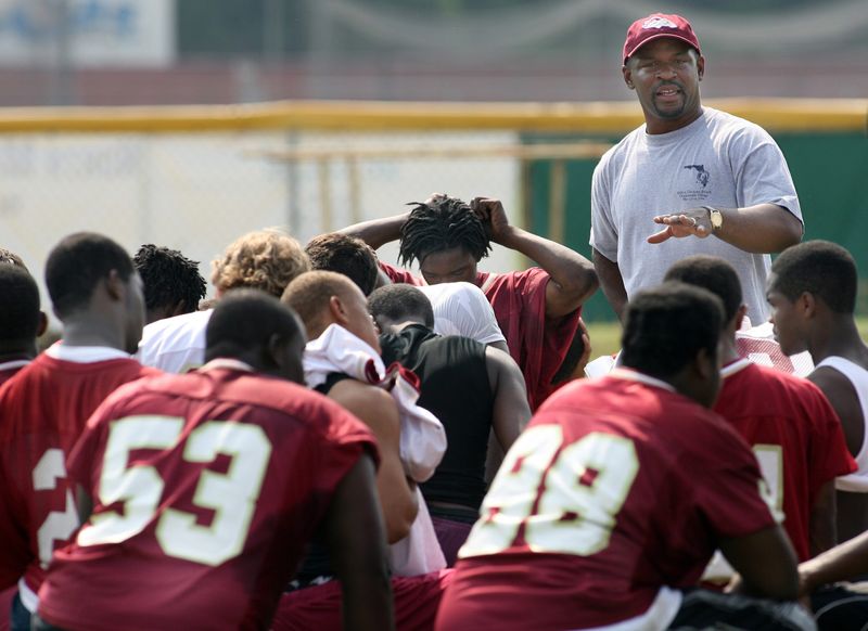 North Marion's head football coach, Craig Damon, talks with members of his team during practice at North Marion High School in Sparr, Fla. on Wednesday, May 2, 2007. The team started its spring practice this week and will be practicing in pads on Friday. (Star-Banner Photo/NYTRENG, Bruce ACKERMAN).