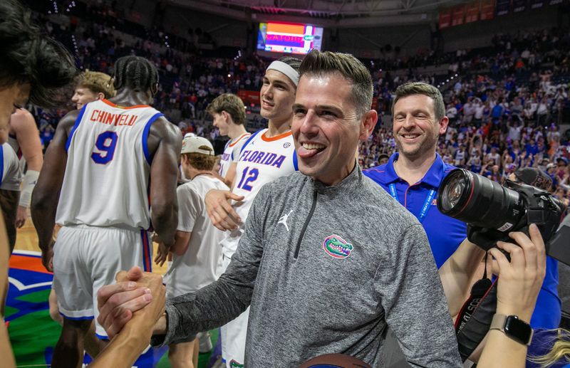 Florida head coach Todd Golden celebrates his 100th win and beating Mississippi State 108-77 an NCAA mens basketball game at Steven C. O'Connell Center Exactek arena in Gainesville, FL on Tuesday, March 3, 2026. [Alan Youngblood/Gainesville Sun]