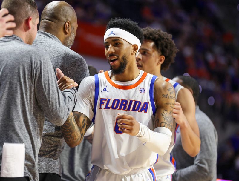 Florida guard Boogie Fland (0) celebrates with the bench during the second half of an NCAA mens basketball game at Steven C. O'Connell Center Exactek arena in Gainesville, FL on Tuesday, March 3, 2026. [Alan Youngblood/Gainesville Sun]