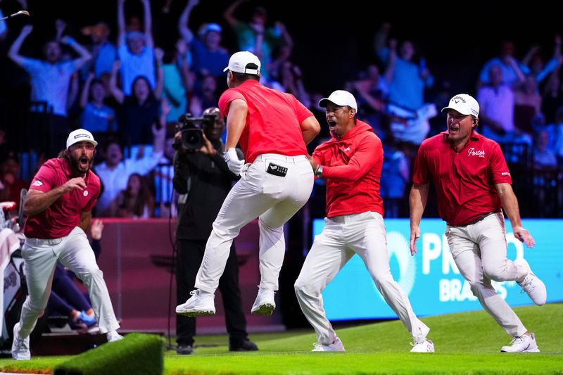 Tom Kim of Jupiter Links GC celebrates with teammates after hitting a hole-in-one on the 14th hole during a match against The Bay Golf Club at SoFi Center on March 03, 2026 in Palm Beach Gardens, Florida.
