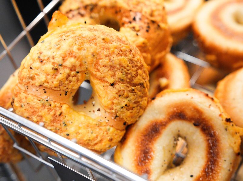 Asiago cheese bagels lay in a wire basket at Jeff's Bagel Run during their soft opening Wednesday March 4, 2026 located at 628 Atlantic Blvd. No. 4 in Neptune Beach, Fla. [Doug Engle/Florida Times-Union]