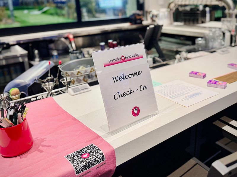 A check-in station provided name tags and match sheets for attendees of Pre-Dating's speed dating singles' event in Daytona Beach on Tuesday, March 3.