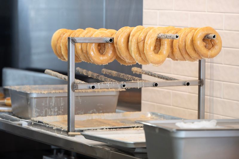 The hand-crafted doughnuts at Peachey’s Baking Co are fried in oil and hand-flipped prior to being hung on a rack to cool. Peachey’s is opening a second Sarasota area location at 999 Cattlemen Road, Unit E.