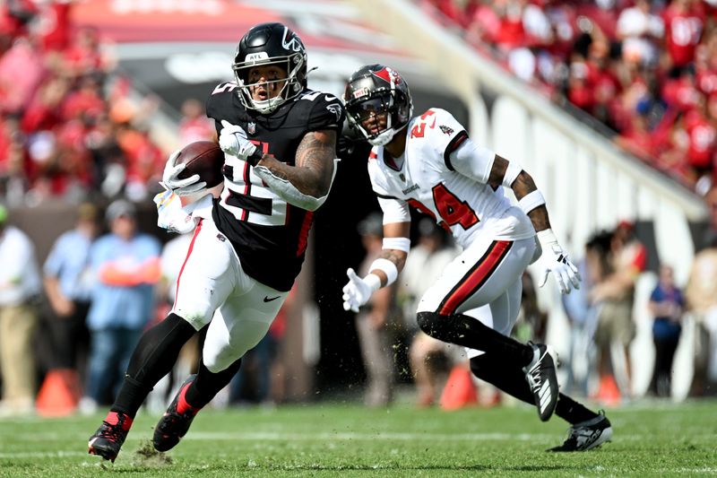 Oct 22, 2023; Tampa, Florida, USA; Atlanta Falcons running back Tyler Algeier (25) runs the ball in the first half against the Tampa Bay Buccaneers at Raymond James Stadium. Mandatory Credit: Jonathan Dyer-USA TODAY Sports