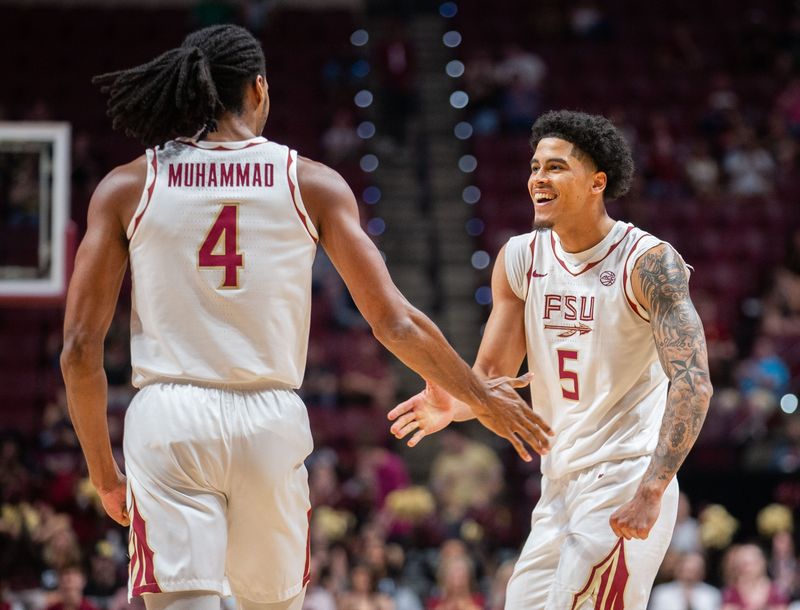 Florida State Seminoles forward Shahid Muhammad (4) and Florida State Seminoles guard Kobe Magee (5) celebrate a shot. The Florida State Seminoles hosted the Southern Methodist University Mustangs at the Tucker Civic Center on Saturday, March 7, 2026.