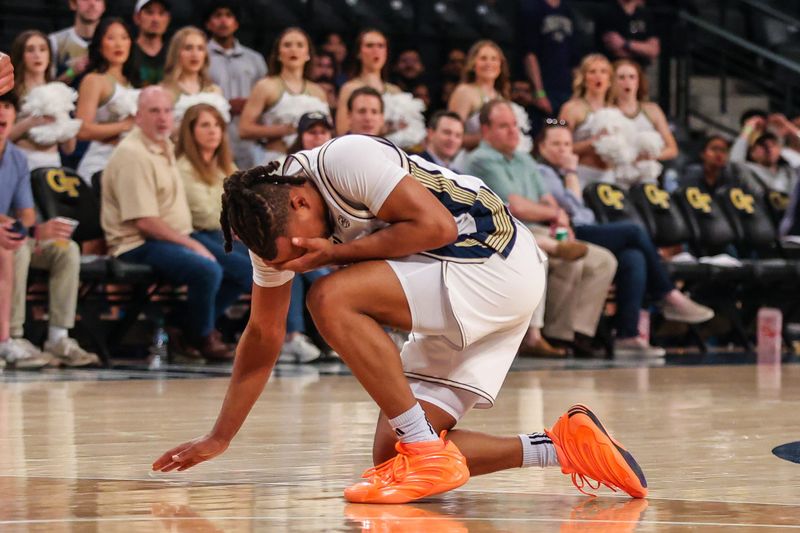 Mar 4, 2026; Atlanta, Georgia, USA; Georgia Tech Yellow Jackets guard Lamar Washington (1) goes to the ground after eye-poke foul against California Golden Bears forward John Camden (2) during the second half at McCamish Pavilion. Mandatory Credit: Jordan Godfree-Imagn Images