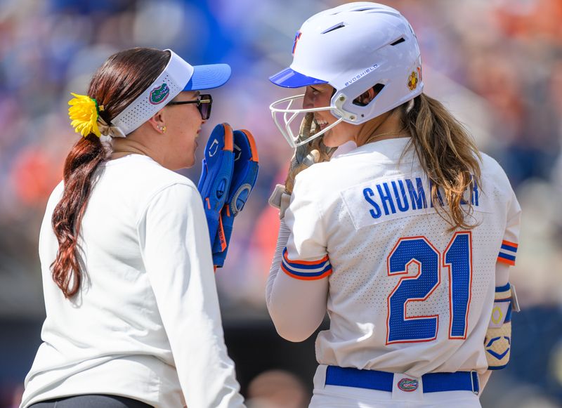 Florida outfielder Taylor Shumaker (21) talks to first base coach Kendra Falby during an NCAA softball game against Missouri at Katie Seashole Pressly Stadium in Gainesville, Fla., Saturday, March 7, 2026. [Noah Lantor/Gainesville Sun]
