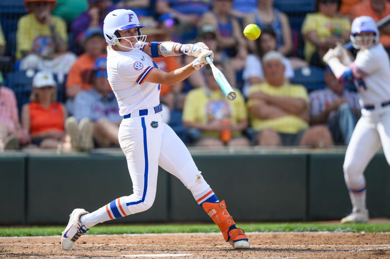 Florida infielder Kendall Grover (12) hits during an NCAA softball game against Missouri at Katie Seashole Pressly Stadium in Gainesville, Fla., Saturday, March 7, 2026. [Noah Lantor/Gainesville Sun]