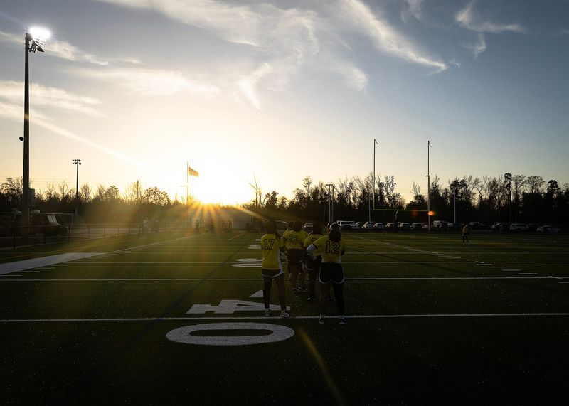 Rutherford flag football players warm up on their new artificial turf field at the Vera Champlain Sports Complex in Panama City, Fla., March 6, 2026. All Bay County high school football fields are scheduled for a similar upgrade. (Tyler Orsburn/News Herald)