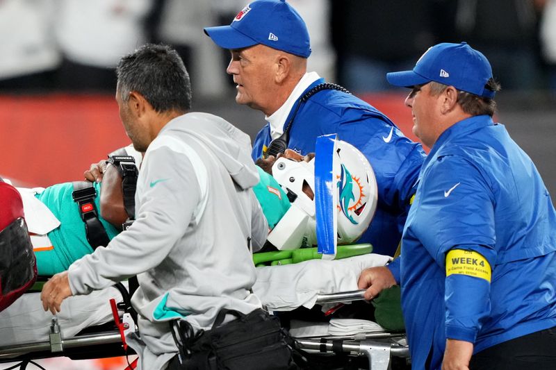 Miami Dolphins quarterback Tua Tagovailoa (1) is taken off the field after suffering a head injury following a sack by Cincinnati Bengals defensive tackle Josh Tupou (not pictured) in the second quarter at Paycor Stadium in Cincinnati.