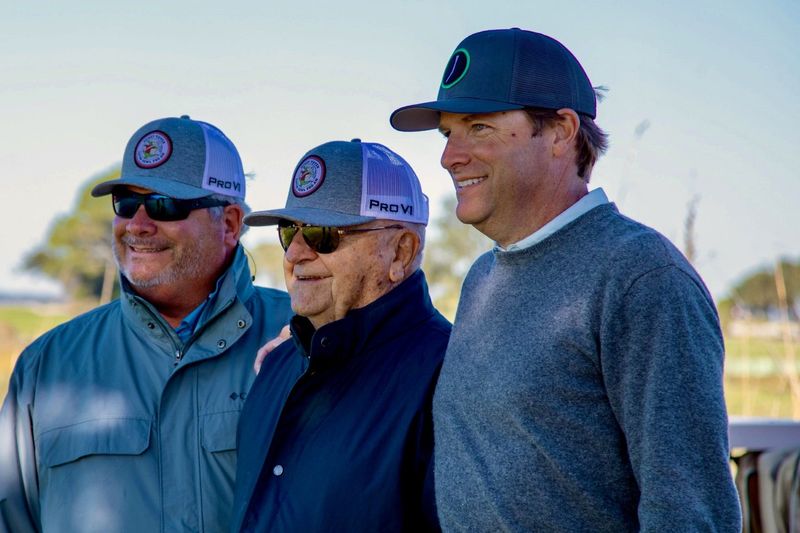 Henry Tuten (center), with his sons Tracy (left) and Chris (right) watch the Gator Bowl Pro-Am in 2024 at the Sea Island Golf Club. Tuten renewed the annual holiday tournament and attracted major champions and PGA Tour winners to the two-day event.
