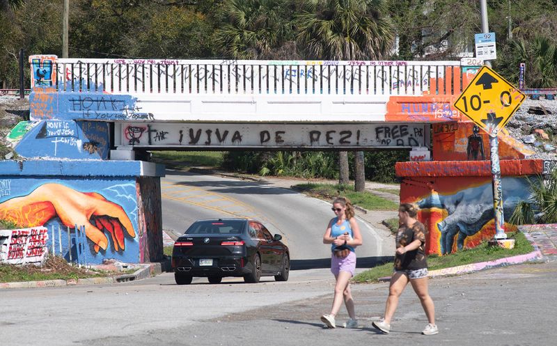 Pensacola plans to install an infrared laser system at Graffiti Bridge this summer that will alert drivers with a bank of flashing lights if their vehicle is too tall to make it under the bridge.