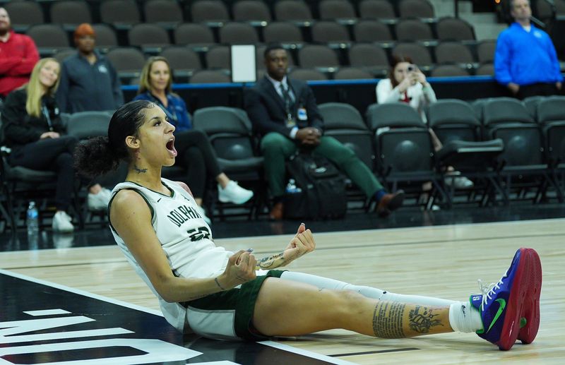 Jacksonville Dolphins guard Priscilla Williams (23) draws a foul in the fourth period. Jacksonville University defeated Austin Peay 66-63 in overtime in the ASUN Women's Basketball Tournament Championship at VyStar Veterans Memorial Arena Monday, March 9, 2026 in Jacksonville, Fla. [Doug Engle/Florida Times-Union]