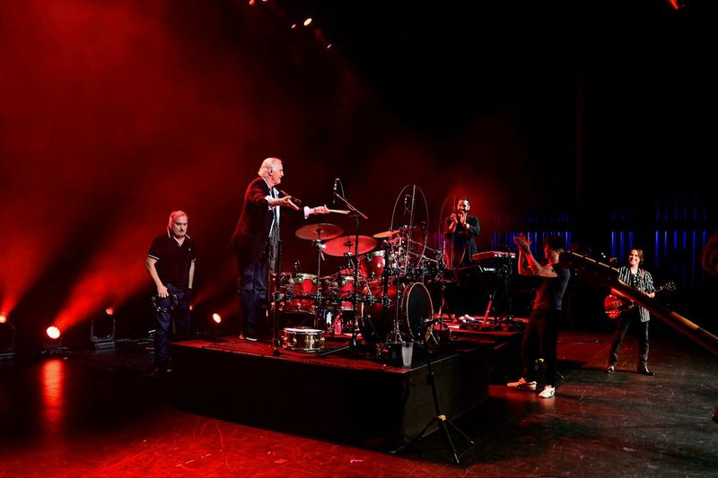Stan Lynch, a successful songwriter and former drummer for Tom Petty & the Heartbreakers, is welcomed by members of Sister Hazel and, second from right, John Rzeznik of the Goo Goo Dolls, during Lyrics for Life on March 7, 2026, in Gainesville.