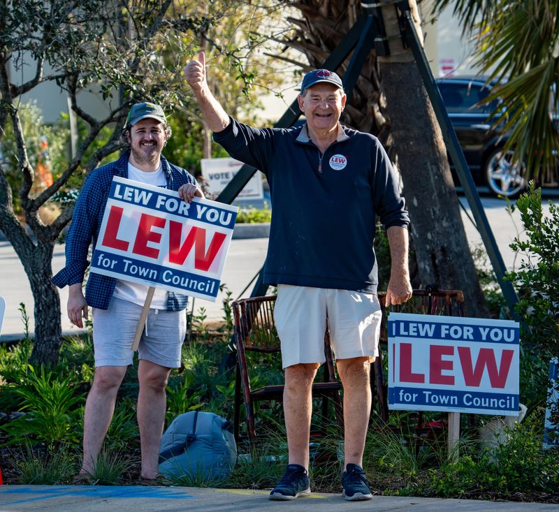 Lew Crampton gives a thumbs-up near the South Fire-Rescue station on the morning of Palm Beach's Group 1 Town Council election on March 10. Crampton defeated John David Corey to win a fifth term.