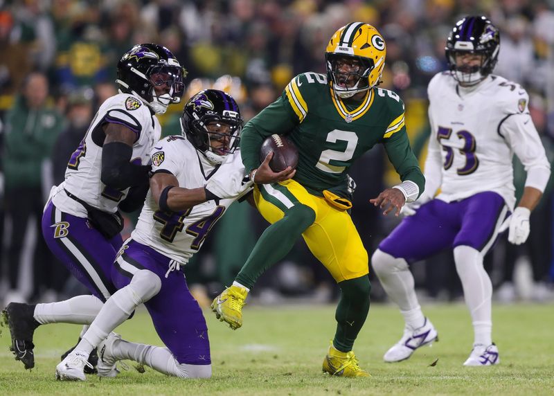 Green Bay Packers quarterback Malik Willis (2) spins out of a tackle by Baltimore Ravens cornerback Marlon Humphrey (44) on Saturday, December 27, 2025, at Lambeau Field in Green Bay, Wis. The Ravens won the game, 41-24.
Tork Mason/USA TODAY NETWORK-Wisconsin