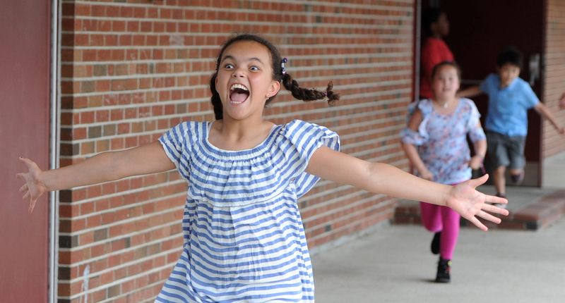 HYANNIS--06/20/18 Sheer joy for third grader Brenda DeSouza as she heads out into summer vacation on the last day of school at Hyannis West Elementary School. 
Steve Heaslip/Cape Cod Times