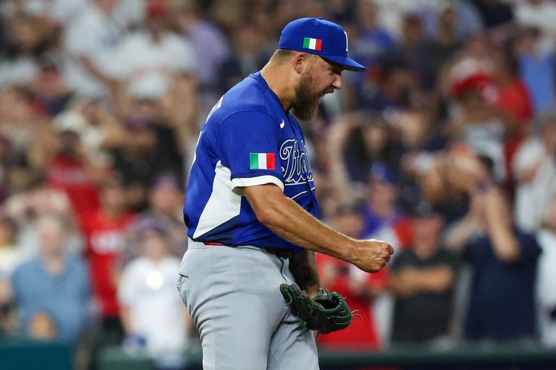 Mar 10, 2026; Houston, TX, United States; Italy pitcher Greg Weissert (57) reacts after Italy defeated the United States at Daikin Park. Mandatory Credit: Thomas Shea-Imagn Images
