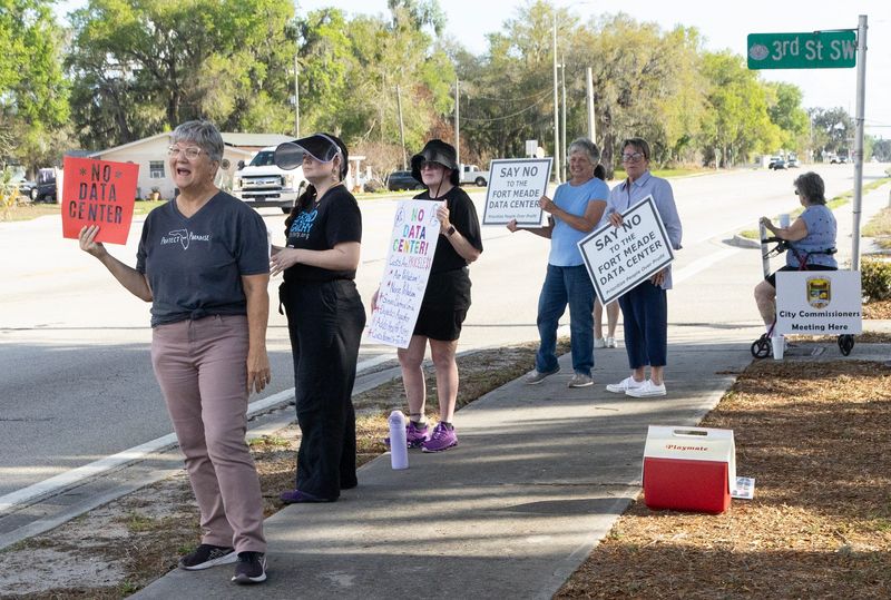 Protesters demonstrate against a planned data center outside the Marcella A. Nelson Community Center before the March 10 Fort Meade City Commission meeting.