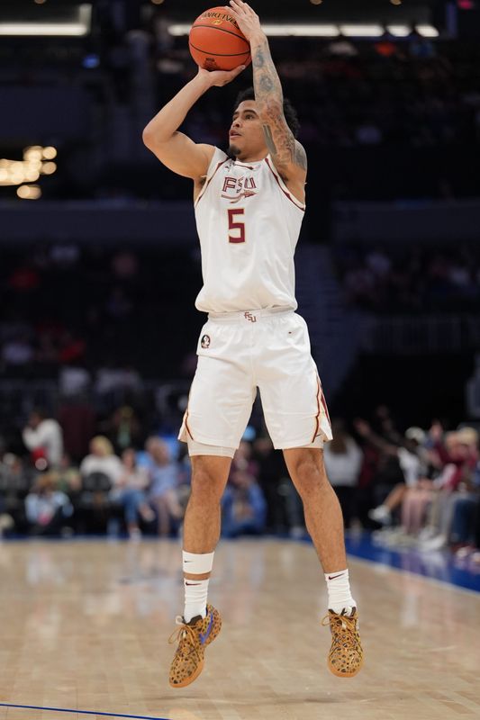 Mar 11, 2026; Charlotte, NC, USA; Florida State Seminoles guard Kobe Magee (5) takes a jump shot against the California Golden Bears during the first half at Spectrum Center. Mandatory Credit: Jim Dedmon-Imagn Images