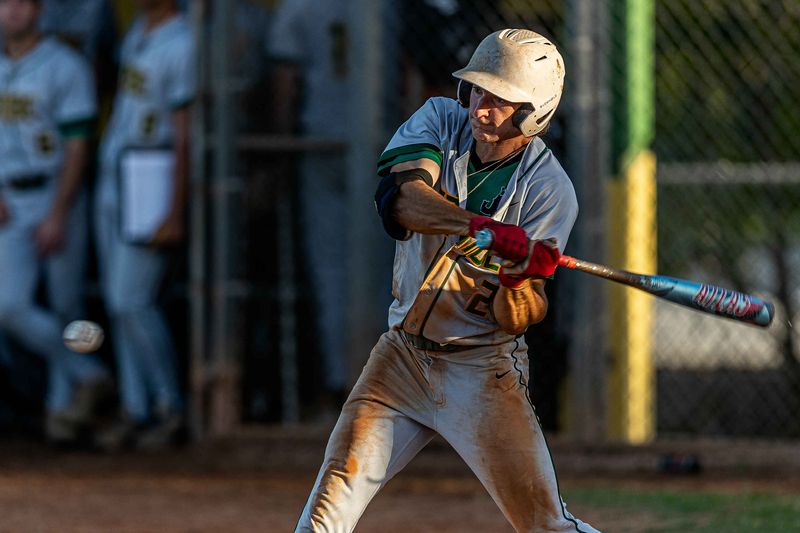 Colby Smith (21) hits the ball as the Boca Raton Community High School Bobcats hosted the Jupiter Community High School Warriors in Florida High School Athletic Association boys' varsity baseball action at Boca Raton Community Middle School in Boca Raton, Fla., on March 11, 2026. The Warrior won 7-0.