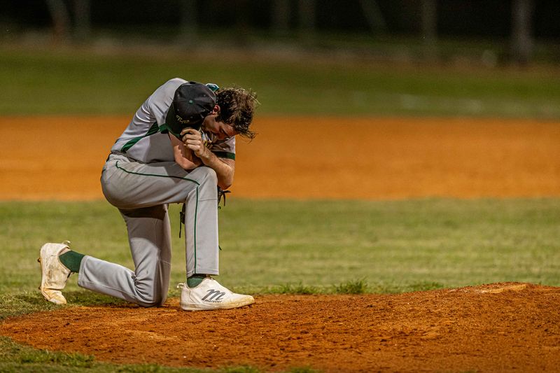 Ethan Trivison (16) readies for the final inning of a complete game allowing no runs as the Boca Raton Community High School Bobcats hosted the Jupiter Community High School Warriors in Florida High School Athletic Association boys' varsity baseball action at Boca Raton Community Middle School in Boca Raton, Fla., on March 11, 2026. The Warriors won 7-0.