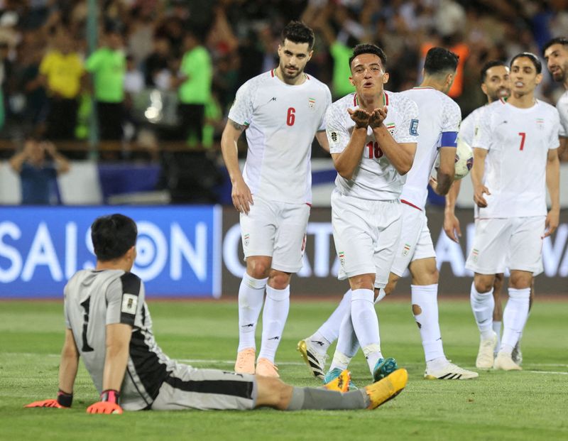 Iran's Amirhossein Hosseinzadeh celebrates scoring their third goal at the World Cup Asian Qualifiers against North Korea on June 10, 2025, but that celebration could be muted if Iran pulls out of the competition.