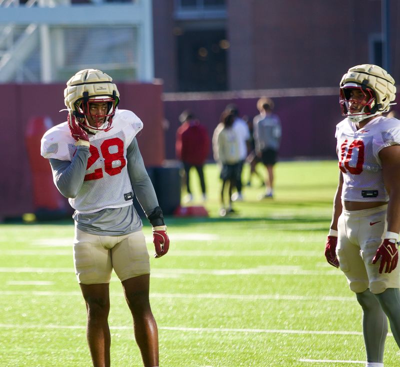 Linebackers Mikai Gbayor (left, 28) and Chris Jones (right, 10) as Florida State football held a spring practice on Friday, March 13, 2026 at the Seminoles practice facility.