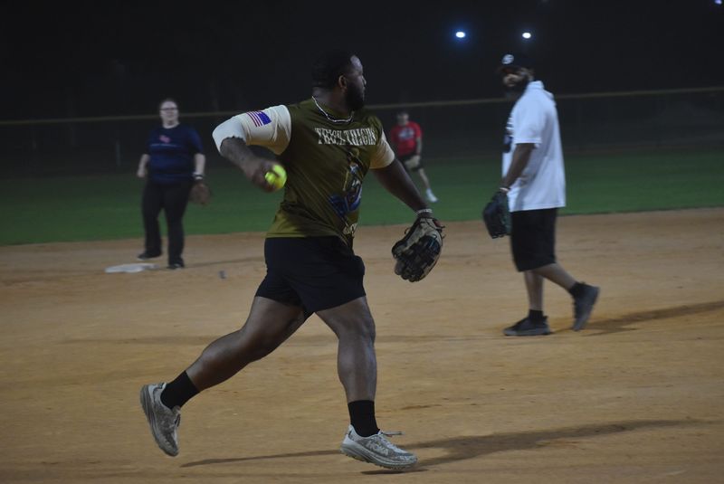 DJayy Gray makes a play for Reissue II in coed softball on March 11. Gray hit a home run, three doubles, and two singles in the 27-17 win over Emerald Coast Roofscapes.
