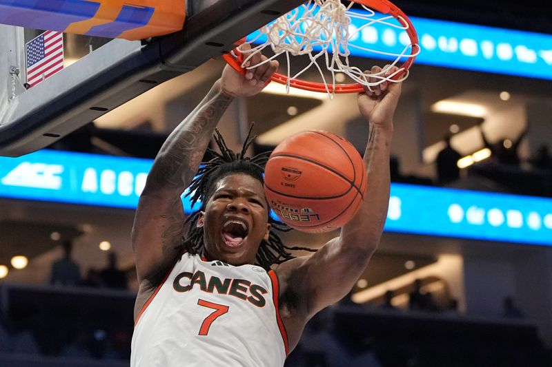 Mar 12, 2026; Charlotte, NC, USA; Miami (FL) Hurricanes forward Shelton Henderson (7) scores the last two points of the game at Spectrum Center. Mandatory Credit: Bob Donnan-Imagn Images