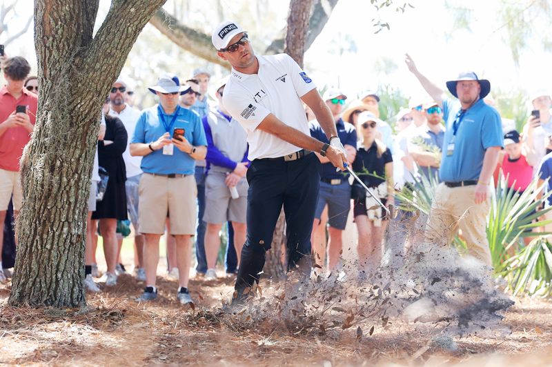 Corey Conners hits from the rough on the 12th hole during the second round of The Players Championship PGA golf tournament at TPC Sawgrass, Saturday, March 14, 2026, in Ponte Vedra Beach, Fla. [Corey Perrine/Florida Times-Union]