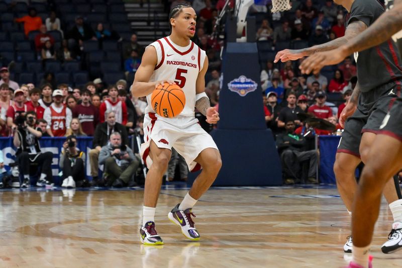 Mar 13, 2026; Nashville, TN, USA; Arkansas Razorbacks guard Darius Acuff Jr. (5) brings the ball up court against the Oklahoma Sooners during the first half at Bridgestone Arena. Mandatory Credit: Steve Roberts-Imagn Imagesduring the first half