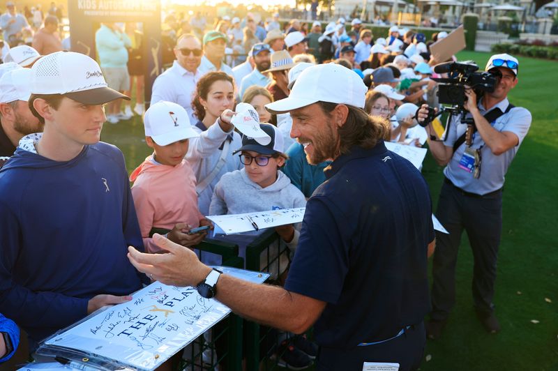 Tommy Fleetwood signs autographs for young fans during the second round of The Players Championship PGA golf tournament at TPC Sawgrass, Friday, March 13, 2026, in Ponte Vedra Beach, Fla. [Corey Perrine/Florida Times-Union]