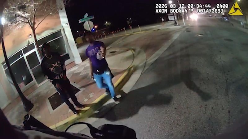 David L. Anderson, 27, of Madison, Tennessee, hands Daytona Beach Police Officer Joel Llinas a drink that Llinas had ordered Anderson to dump. "No, you can pour it out," Anderson tells the officer, body-worn footage from Llinas shows.