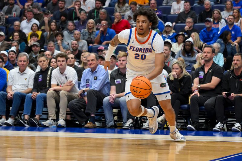 Mar 14, 2026; Nashville, TN, USA; Florida Gators guard Isaiah Brown (20) drives baseline against the Vanderbilt Commodores during the first half at Bridgestone Arena. Mandatory Credit: Steve Roberts-Imagn Images