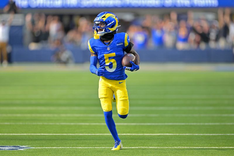 Sep 28, 2025; Inglewood, California, USA; Los Angeles Rams wide receiver Tutu Atwell (5) runs for a touchdown on an 88 yard pass play in the fourth quarter against the Indianapolis Colts at SoFi Stadium. Mandatory Credit: Jayne Kamin-Oncea-Imagn Images