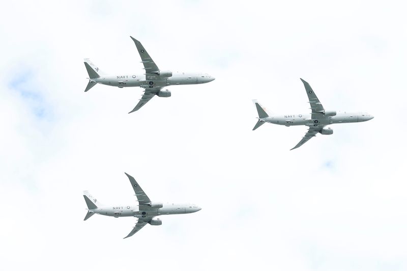A trio of P-8A aircraft from Navy Patrol and Reconnaissance Squadron Thirty (VP-30), of NAS Jacksonville, fly overhead near the fourth hole and practice course during the third round of The Players Championship PGA golf tournament at TPC Sawgrass, Saturday, March 14, 2026, in Ponte Vedra Beach, Fla. [Corey Perrine/Florida Times-Union]