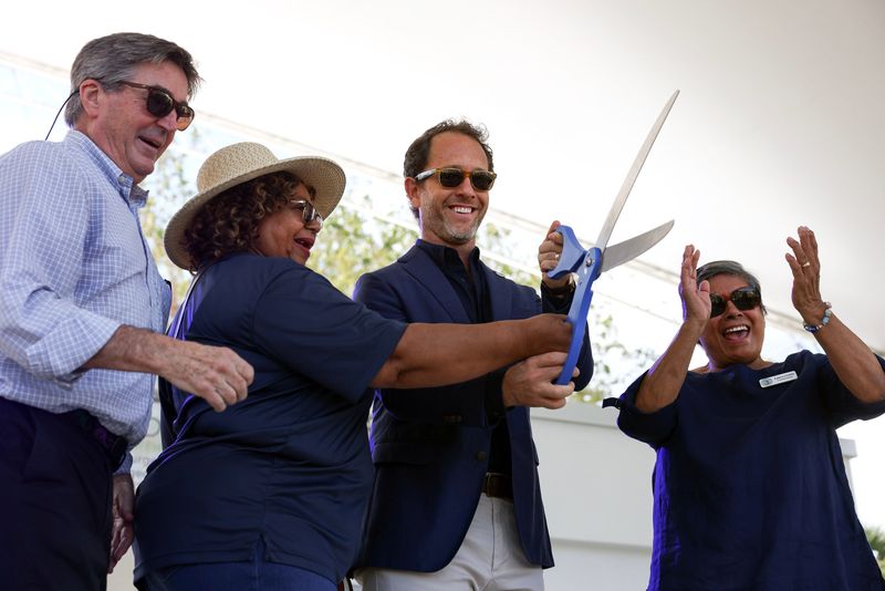 Commissioners, from left, Campbell Rich, Eula Clarke, Mayor Christopher Collins and Laura Giobbi cut the ribbon during the grand opening of the new amphitheater at Veterans Memorial Park on March 14, 2026.