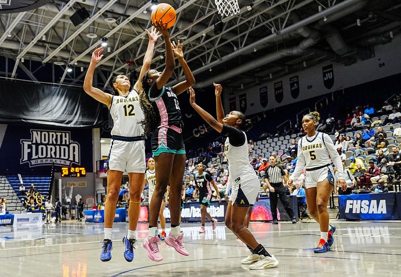 Shamora Scott of Bayside shoots through the defense of Isabella Sangha and Laila Barnett of St. Thomas Aquinas in the FHSAA Class 6A state girls basketball finals March 14, 2026. Craig Bailey/FLORIDA TODAY via USA TODAY NETWORK