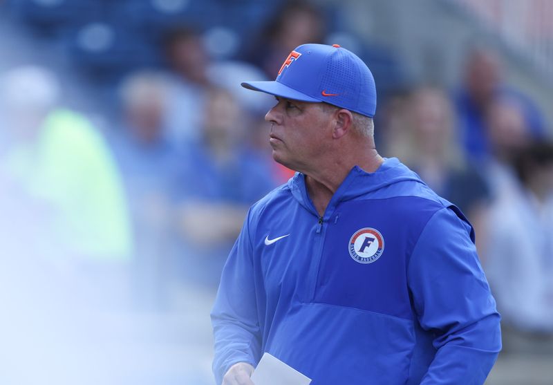 Florida head coach Kevin O'Sullivan heads to the dugout during an NCAA baseball game at Condron Ballpark in Gainesville, FL on Friday, March 13, 2026. [Alan Youngblood/Gainesville Sun]