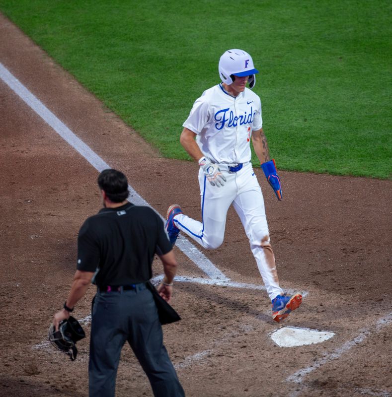 Florida outfielder Kyle Jones (3) scores off Florida infielder Ethan SurowiecÃ•s (10) RBI single against Florida State, March 10, 2026, at Condron Family Ballpark in Gainesville, Florida. [Cyndi Chambers/ Gainesville Sun] 2026