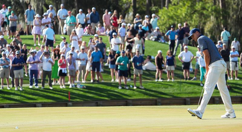 Ludvig Åberg drops his ball in the cup on the 11th green to make eagle during the third round of The Players Championship golf tournament at TPC Sawgrass, in Ponte Vedra Beach, Fla. Saturday March 14, 2026. [Doug Engle/Florida Times-Union]