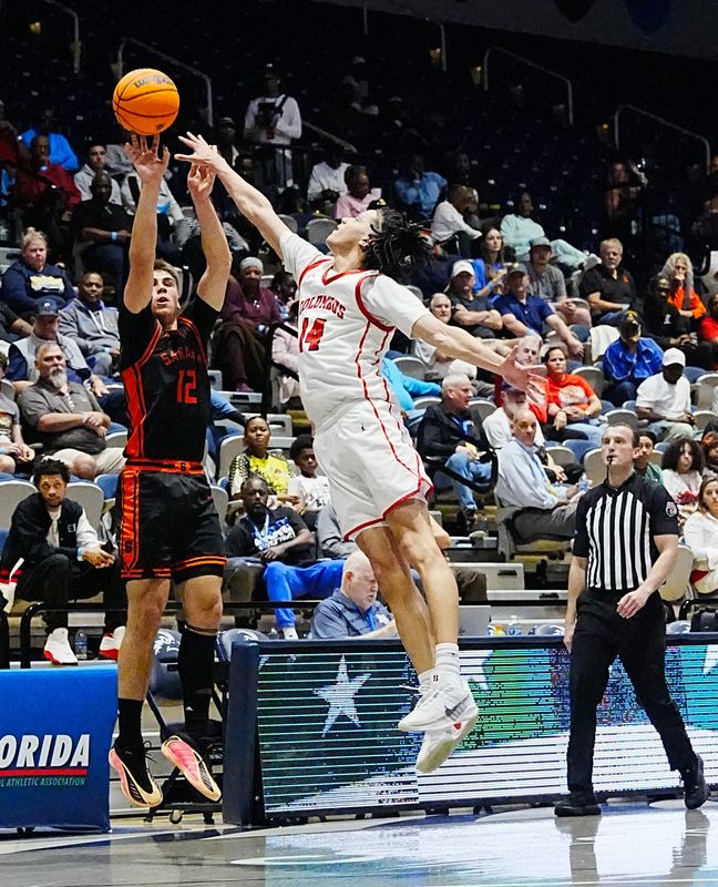 Johnny Lackaff of Sarasota is guarded by Felipe Quinones of Columbus as he takes a shot in the FHSAA Class 7A state boys basketball finals March 14, 2026. Craig Bailey/FLORIDA TODAY via USA TODAY NETWORK