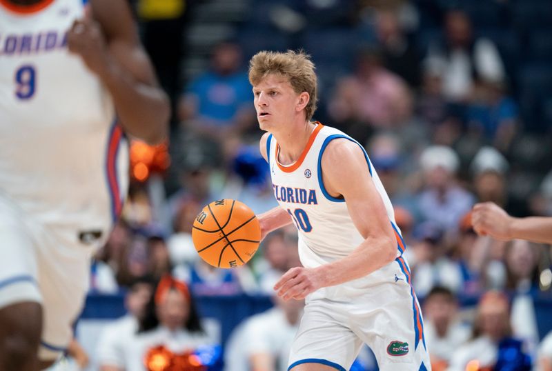 Florida forward Thomas Haugh (10) handles the ball against Vanderbilt during their semifinal game of the 2026 SEC Menâ€™s Basketball Tournament at Bridgestone Arena in Nashville, Tenn., Saturday, March 14, 2026.